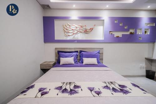 Postel nebo postele na pokoji v ubytování Bali Puspa Guest House