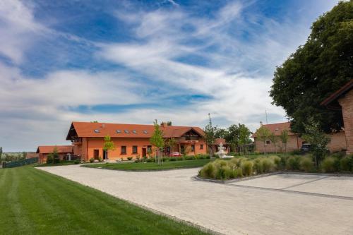 an empty driveway in front of a building at Hotel Kúria Červený Majer in Senec