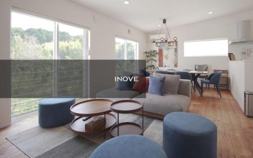 a living room with a couch and chairs and a table at INOVE VILLA Ritto in Ritto