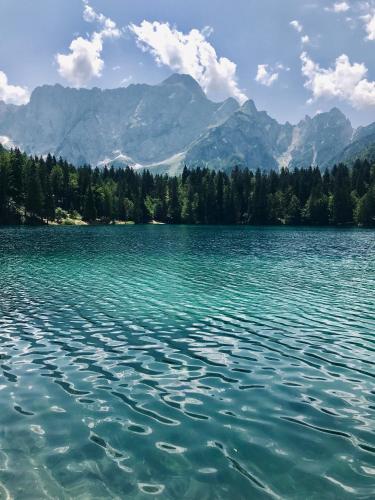 a large body of water with mountains in the background at Villa Rosa Tarvisio in Tarvisio