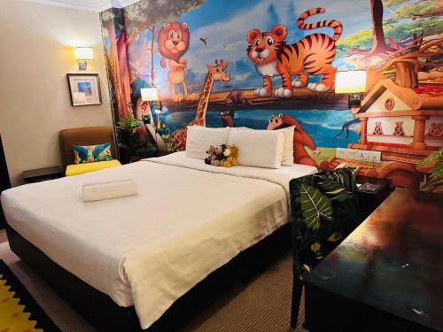 a bedroom with a large bed with a mural at Merchant Hotel in George Town