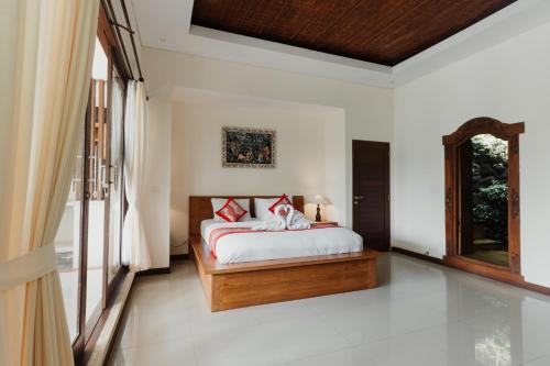 Кровать или кровати в номере The Iyang Ubud
