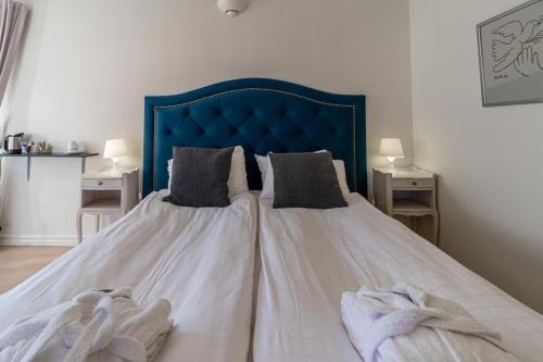 Un ou plusieurs lits dans un hébergement de l'établissement First Hotel Olofström
