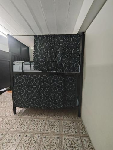 a small room with a black and white wall at Phuket Inn Patong Hub in Patong Beach