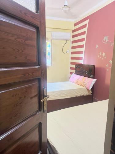 a door leading into a room with a bunk bed at SEO House in Aswan