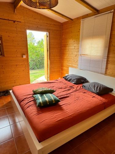 a bedroom with a large bed with pillows on it at Micasa Ibiza in San Antonio
