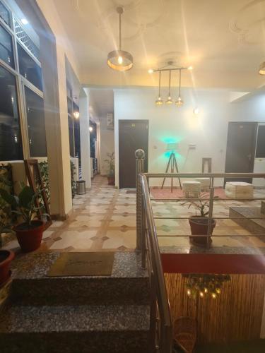 a hallway of a building with a table at Mild Life Hostel Rishikesh in Rishīkesh