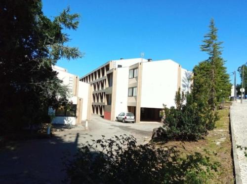a building with a car parked in front of it at Special place in São Pedro do Sul in São Pedro do Sul