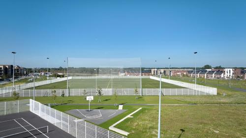 an empty basketball court with a basketball hoop at New House, Private Rooms in a Peaceful Neighborhood in Dublin