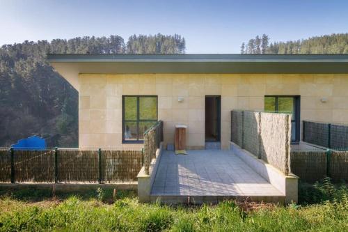 a small house with a ramp in front of it at Beautiful townhouse 20km from Bilbao in Llodio
