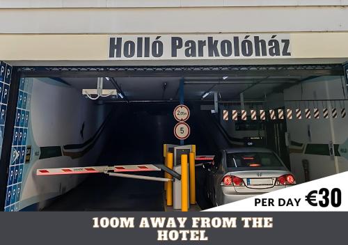 a car is parked in a parking garage at Hotel Memories Budapest in Budapest