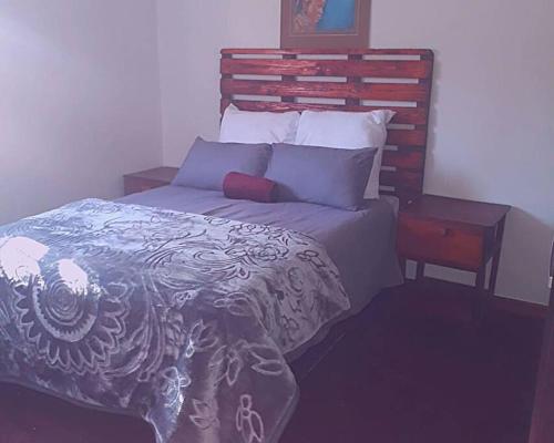Ένα ή περισσότερα κρεβάτια σε δωμάτιο στο 2 bedroom guesthouse suitable for groups