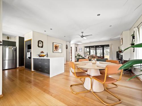 a kitchen and living room with a table and chairs at La Casa Gracie, Balga Sanctuary in Margaret River in Gracetown