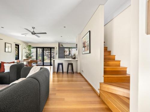 a living room with white walls and wooden floors at La Casa Gracie, Balga Sanctuary in Margaret River in Gracetown