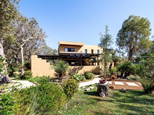 a house in the middle of a garden at La Casa Gracie, Balga Sanctuary in Margaret River in Gracetown