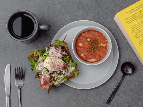a plate of food with a bowl of soup and a salad at LAMP LIGHT BOOKS HOTEL sapporo in Sapporo