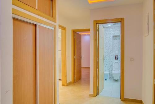 a hallway with a bathroom with a toilet at Timitar, your own Cozy apartment in Agadir