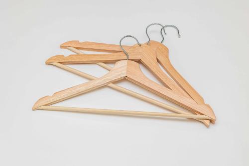 a bunch of wooden hangers hanging on a hook at 1688House美ら海 in Motobu