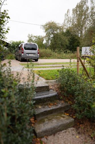 a van parked on the side of a road at La Dame Jeanne in Brakel