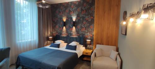 Postel nebo postele na pokoji v ubytování Hotel Szara Willa