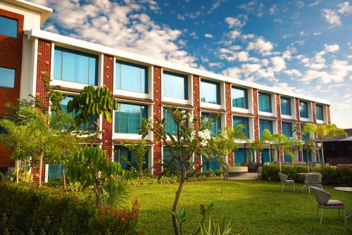 an office building with a lawn in front of it at Elements by Rosetta- Varca, Goa in Varca