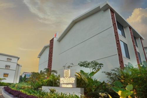a white building with a sign in front of it at Elements by Rosetta- Varca, Goa in Varca
