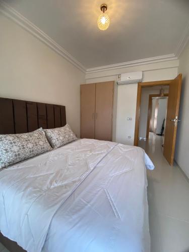 Postel nebo postele na pokoji v ubytování Confort et Vue Mer Appartement avec Piscine