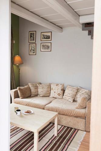 a living room with a couch and a coffee table at Guest House Ioanna Arachova in Arachova