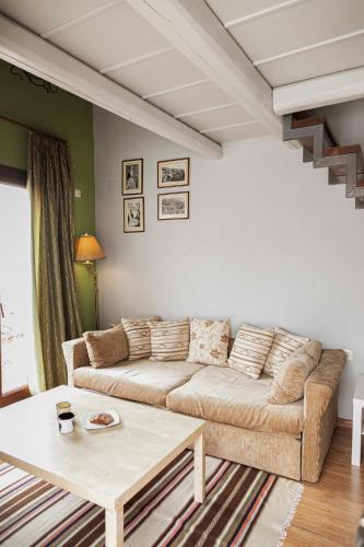 a living room with a couch and a table at Guest House Ioanna Arachova in Arachova
