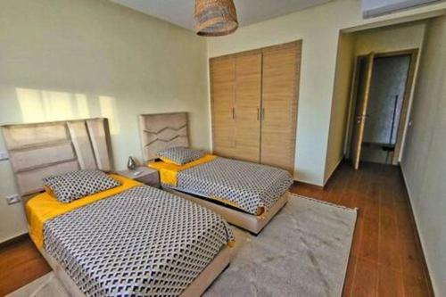 Katil atau katil-katil dalam bilik di Magnifique appartement spacieux avec une belle terrasse ensoleillée
