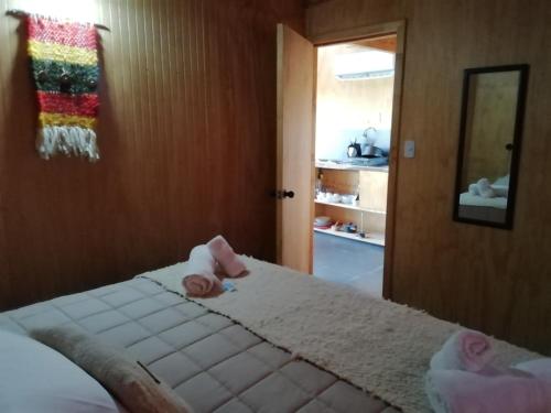 Postel nebo postele na pokoji v ubytování Cabañas Lodge Patagonia truful