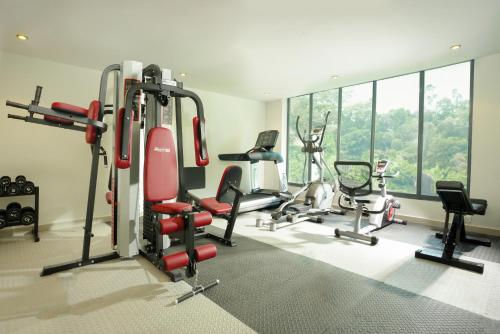 a gym with several treadmills and exercise bikes at Elements by Rosetta- Varca, Goa in Varca