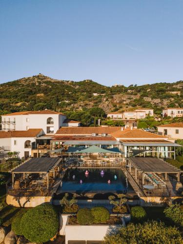an aerial view of a resort with a swimming pool at La Villa Calvi in Calvi
