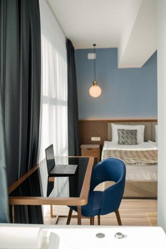 Una cama o camas en una habitación de Hotel Drim & SPA
