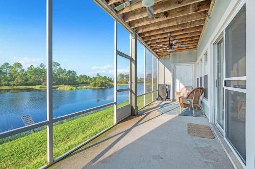 an expansive porch with a view of the water at Romar Lakes 104B in Orange Beach