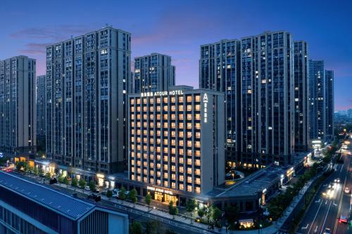 a city with tall buildings at night with traffic at Atour Hotel Hangzhou Xiaoshan Kaiyuan Plaza in Xiaoshan
