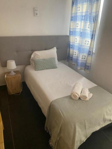 Ένα ή περισσότερα κρεβάτια σε δωμάτιο στο Casa de Porto Covo
