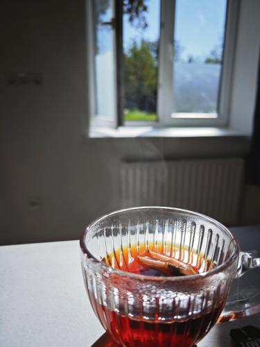 a glass bowl filled with liquid on a table at homecoming in Rīga