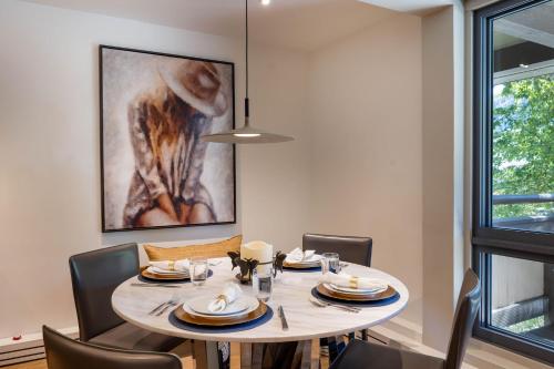 a dining room with a table and chairs at Luxurious 2 BR, 2 BA - Aspen Core in Aspen