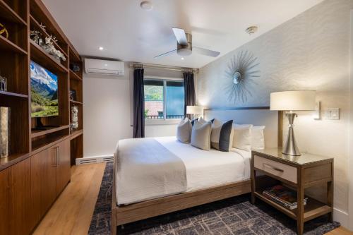 a bedroom with a large bed and a window at Luxurious 2 BR, 2 BA - Aspen Core in Aspen