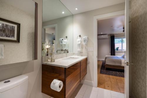 a bathroom with a sink and a mirror at Luxurious 2 BR, 2 BA - Aspen Core in Aspen