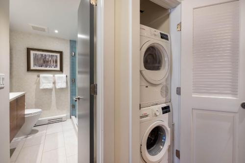 a bathroom with a washing machine and a washer and dryer at Luxurious 2 BR, 2 BA - Aspen Core in Aspen