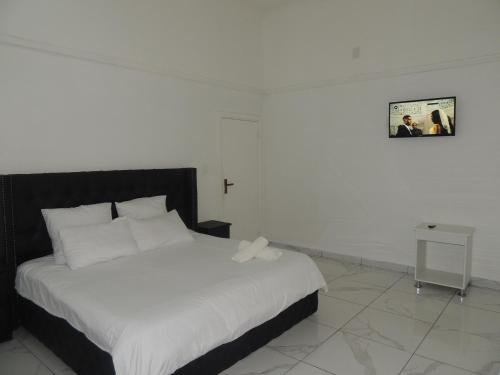 Ένα ή περισσότερα κρεβάτια σε δωμάτιο στο De Dreamz Guest House