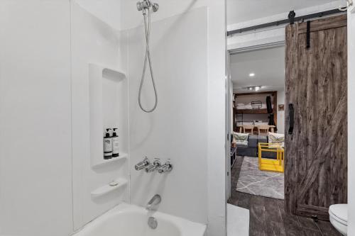 a bathroom with a shower and a sink at Cheery Flat in Adams Morgan - Mt Pleasant in Washington, D.C.