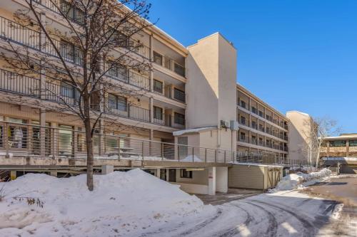 an apartment building with snow in front of it at Luxurious 2 BR, 2 BA - Aspen Core in Aspen