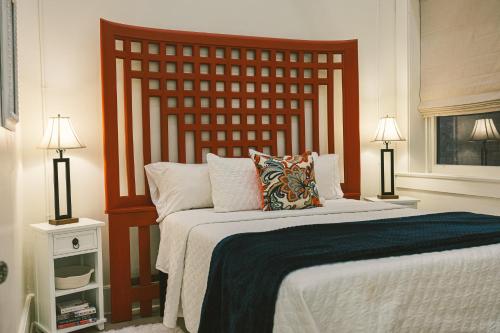 a bedroom with a large bed and two lamps at Warner Hotel in Bisbee