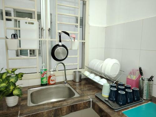 a kitchen with a sink and a counter top at MGM-Tebrau City Walk within 5 min to AEON Mall, Ikea & Toppen in Johor Bahru