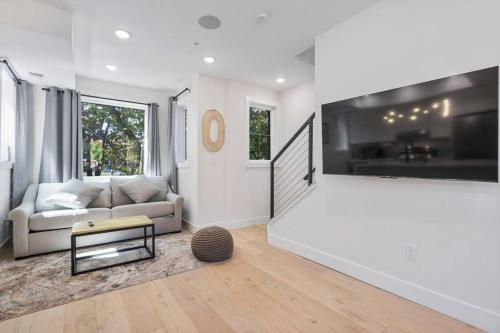 a living room with a couch and a table at Capitol Hill 4 Charming Townhouse in Downtown DC with Rooftop Free Parking and WIFI in Washington, D.C.