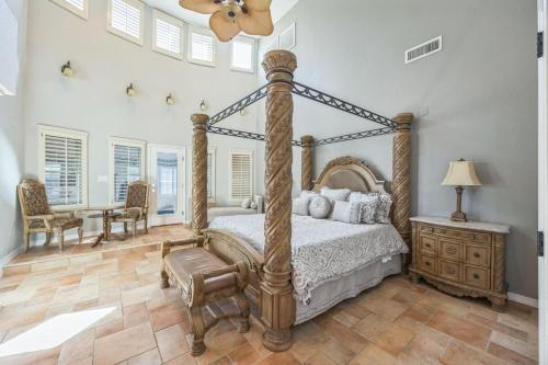 a bedroom with a bed and a table and chairs at 438 Indoor Pool with a Theater Room in Homestead Meadows South