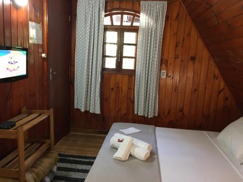 Una cama o camas en una habitación de Recanto Suíço